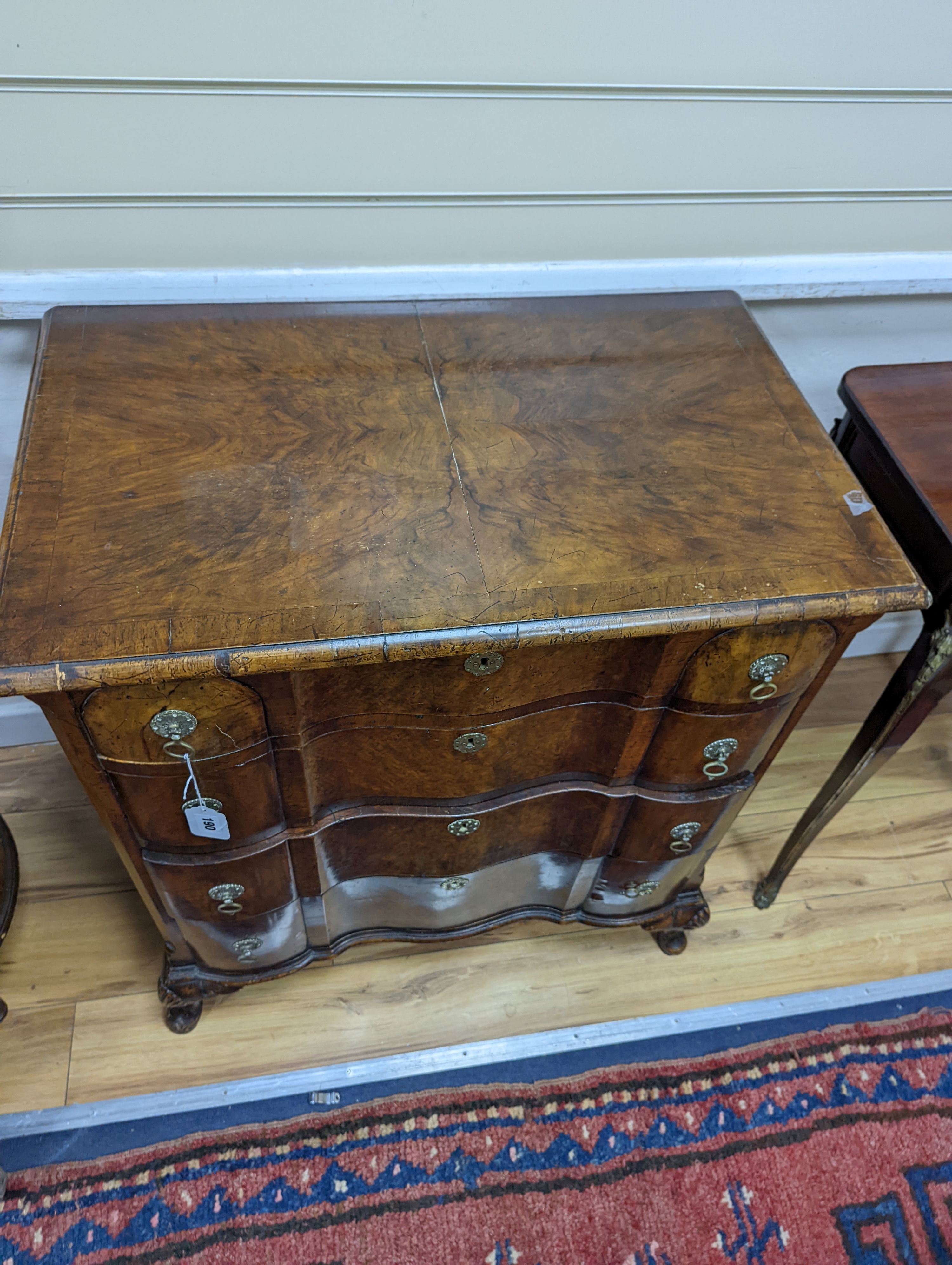 An early 20th century Queen Anne revival banded walnut shaped front chest, width 77cm, depth 46cm, height 85cm